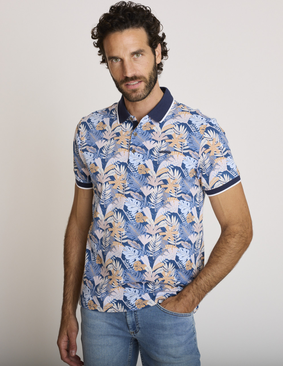 Polo stampata tropicale blu...